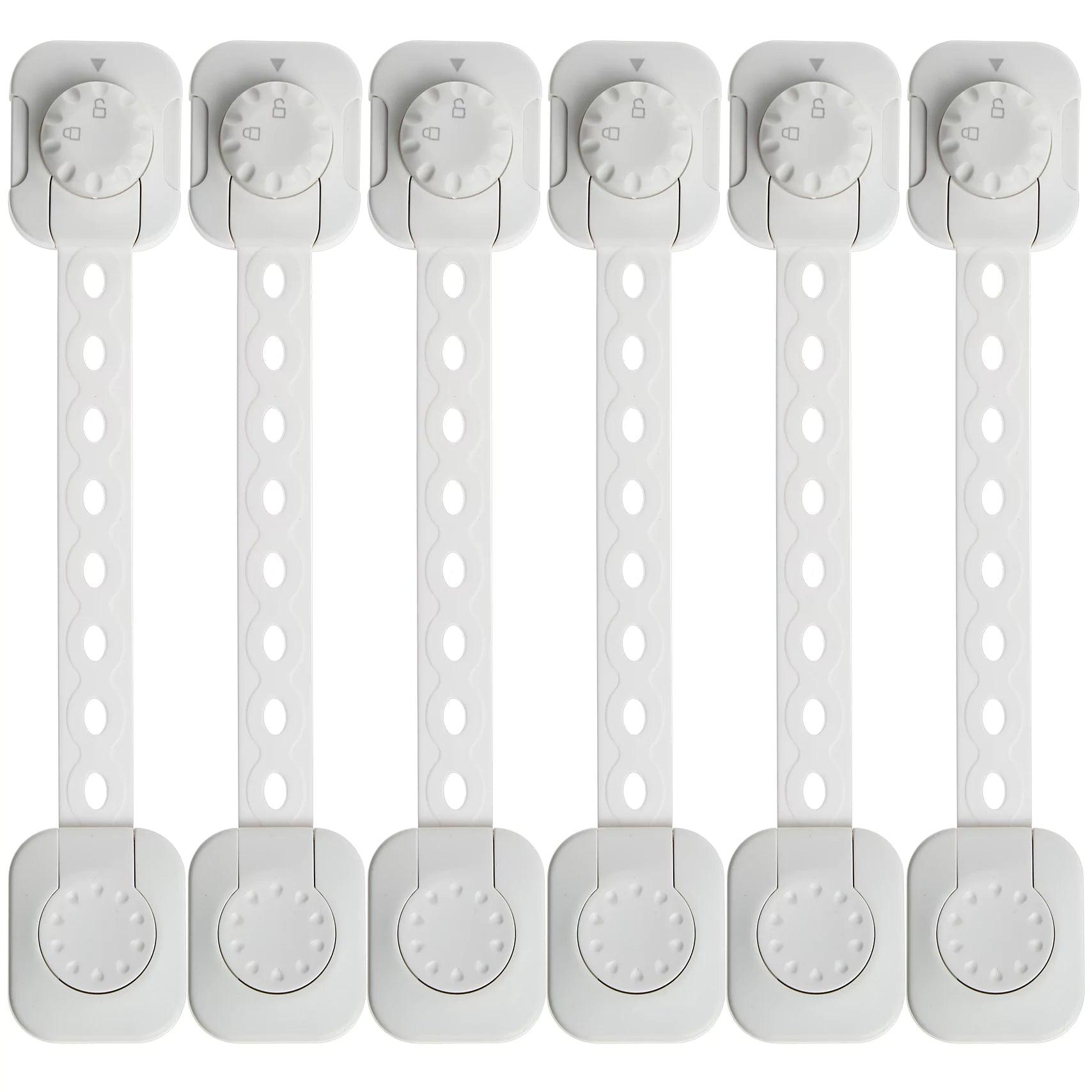 Set med sex vita barnlås med dubbel låsfunktion och flexibel rem för skåp och lådor.