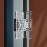 Transparent barnsäkert lås monterat på skjutdörr eller skjutfönster.