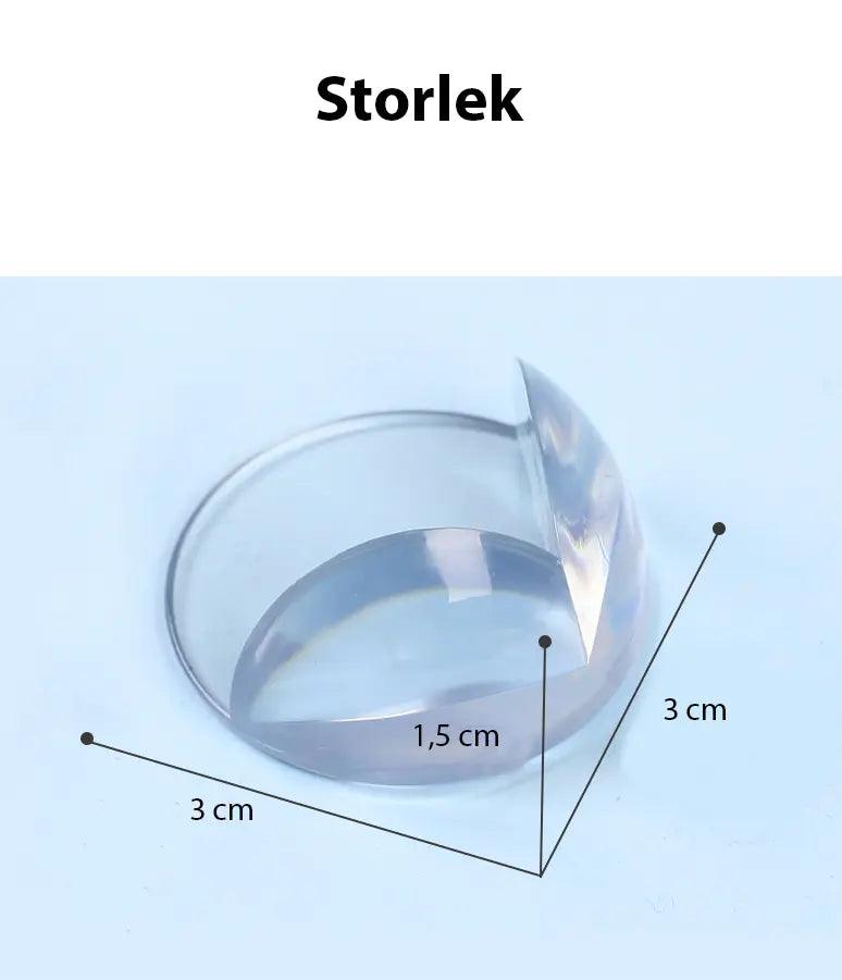 Transparent hörnskydd av silikon med måttangivelser 3 cm i bredd och höjd samt 1,5 cm tjocklek, visat mot ljus bakgrund.