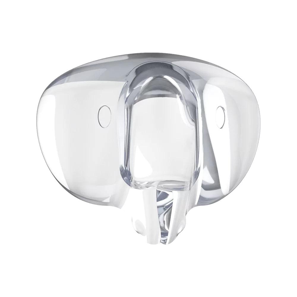 Transparent extra skyddande hörnskydd i silikon för barnsäkra möbelhörn, visad framifrån.