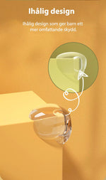 Transparent extra skyddande hörnskydd i silikon med ihålig design monterat på gult möbelhörn, visat i närbild med illustrerad förklaring.