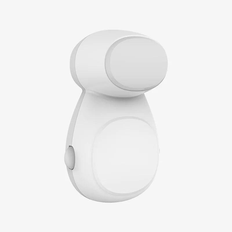 Vitt automatisk klämskydd för dörrar med rundad design och knapp på sidan.