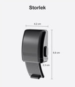 Svart barnsäkert ugnslås med mått 8,8 × 4,2 × 2,3 cm, visat i närbild för att tydliggöra storlek och design